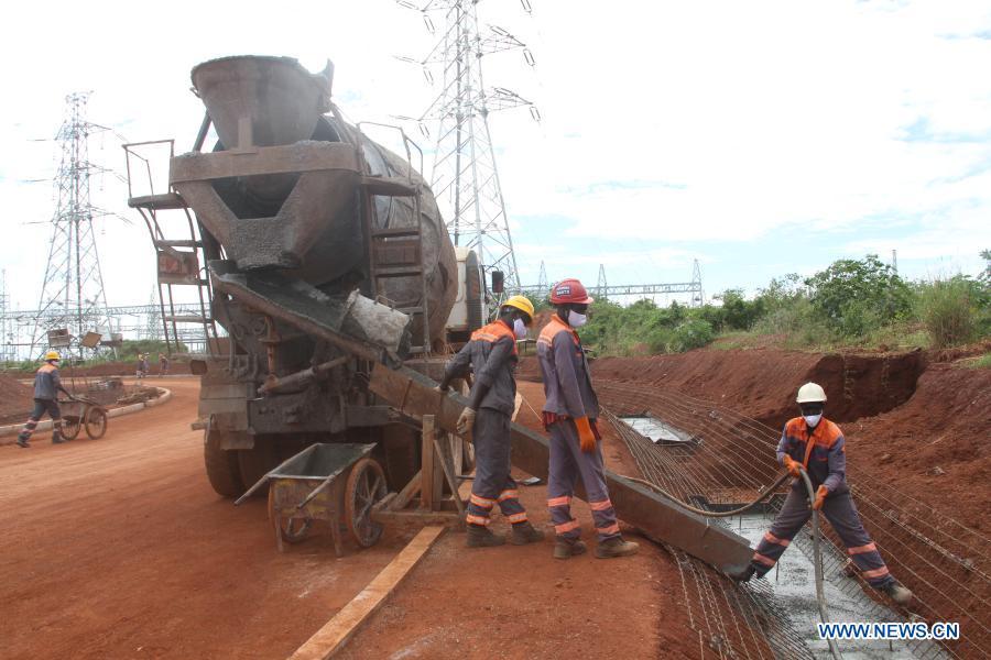 Local employees cast concrete for drainage ditch of the Karuma hydropower project under construction in the midwestern Ugandan district of Kiryandongo, Nov 9, 2020. Source: https://for-africa.com/ugandas-karuma-hydropower-plant-nearing-completion/