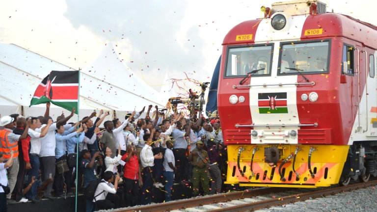 People throw confetti at the port city of Mombasa on May 30, 2017, after Kenyan President Uhuru Kenyatta inaugurated a cargo train before its first journey to Nairobi. Source: https://news.cgtn.com/news/3d49544f3541444e/share_p.html