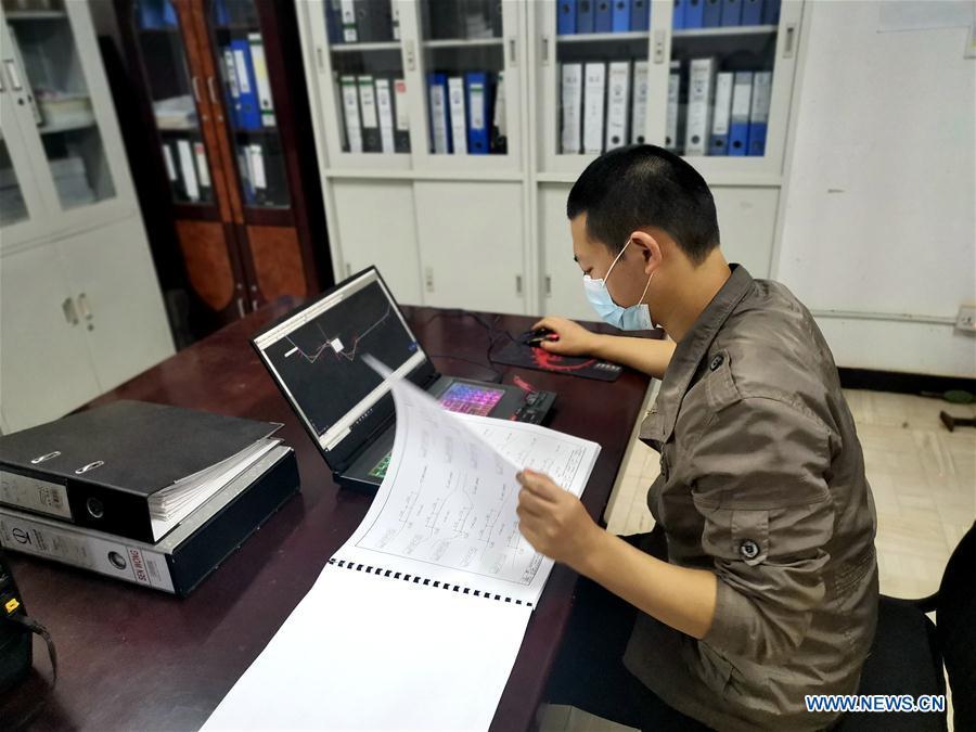 Assistant engineer Zhang Guikai drafts a map for Tanzania's Central Railway Line rehabilitation project undertaken by China Civil Engineering Construction Corporation at a project site in Tanzania on Aug. 5, 2020. Source: http://www.xinhuanet.com/english/africa/2020-08/14/c_139290023_4.htm